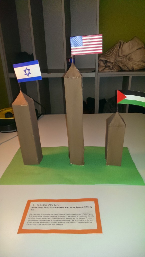 "America's shadow" The shadow of America is on Palestine but as time passes it shifts to Israel representing a hope for balance in our actions there.